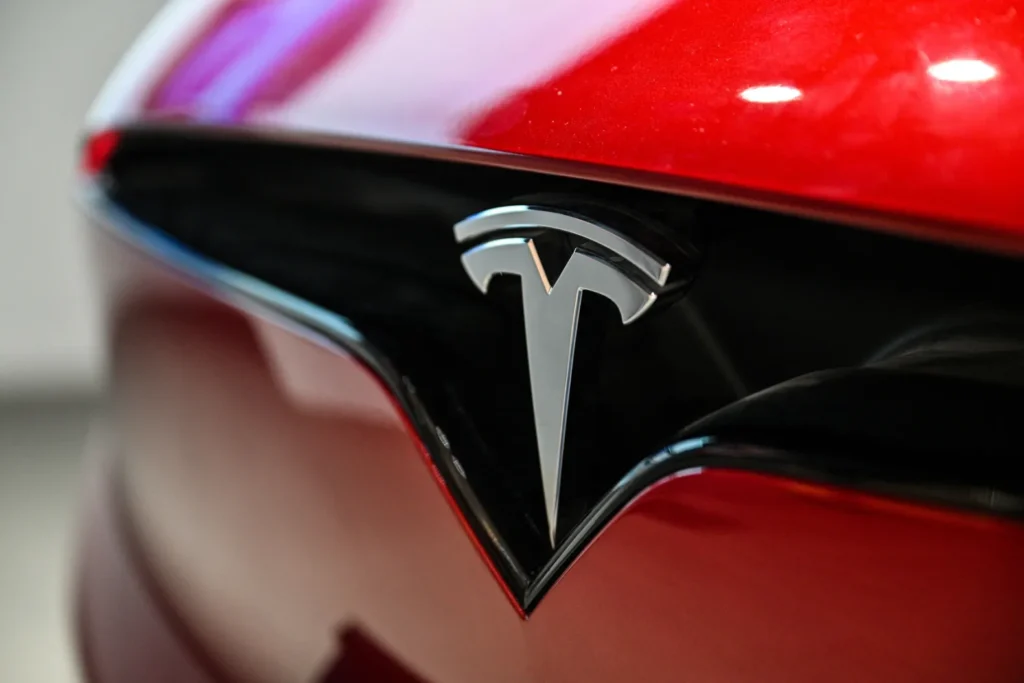 Close-up of Tesla front badge after professional mobile tesla paint repair in Phoenix